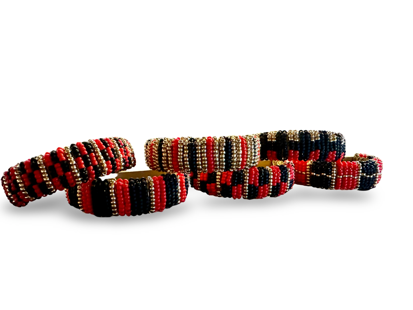 Set of six beaded napkin rings from The Vault Creative, featuring colorful, handcrafted beaded designs for elegant table settings.