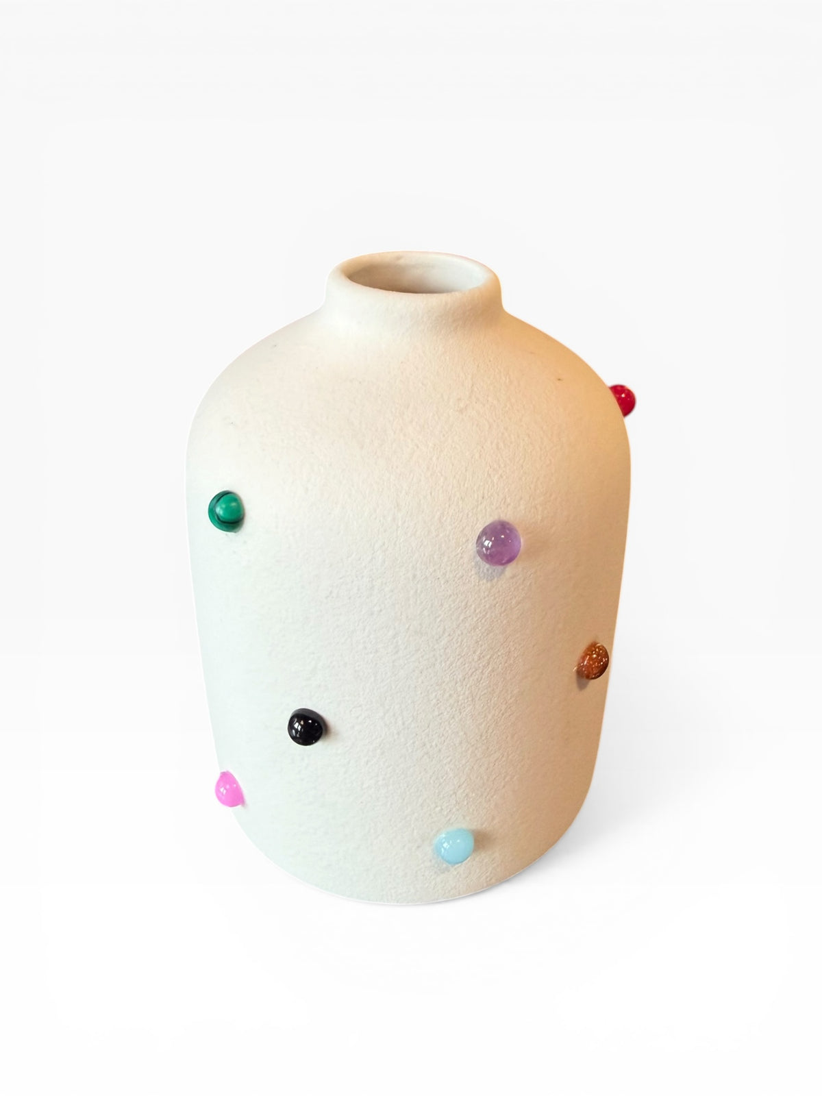 Phoebe P. Grunsfeld June Bud Vase in ceramic with a smooth, rounded shape and subtle floral details, ideal for small flower arrangements.