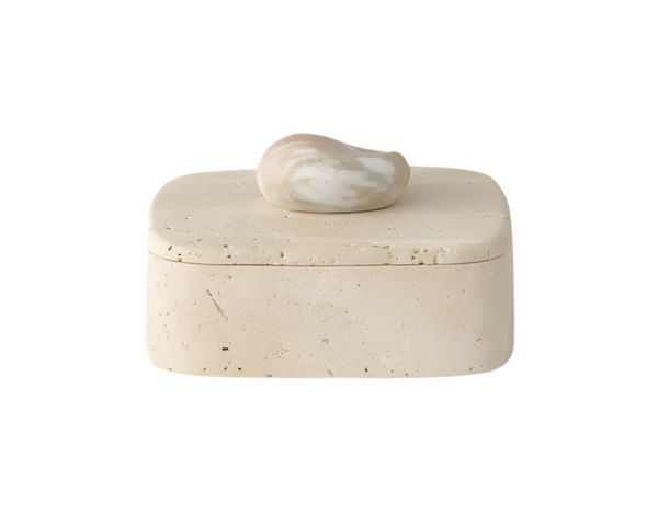 The Vault Creative Pietra Box in travertine and rose features a sleek, rectangular design with a textured stone surface.