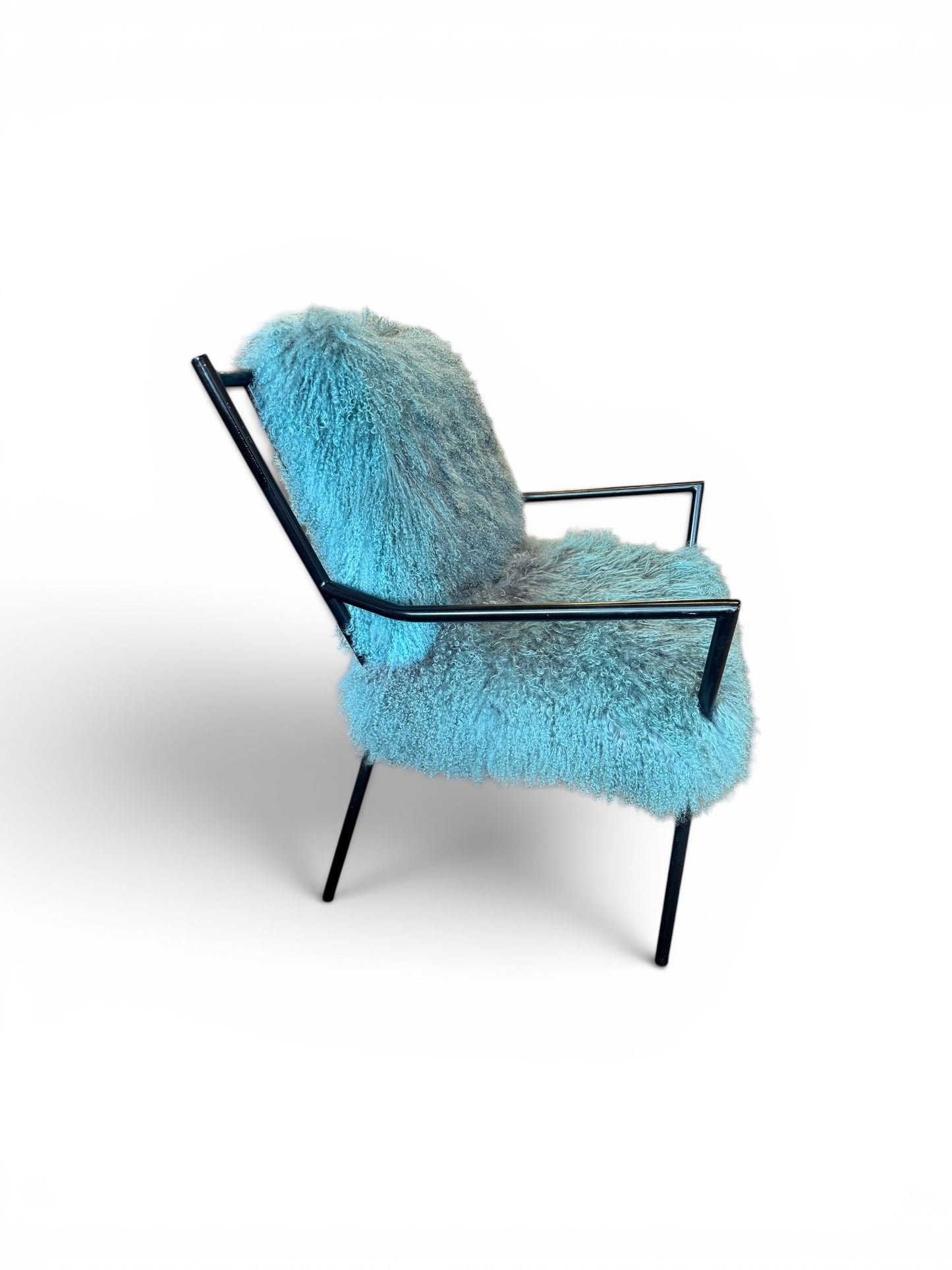 Curly lamb chair by The Vault Creative featuring a plush, textured lamb fur upholstery and modern design elements.
