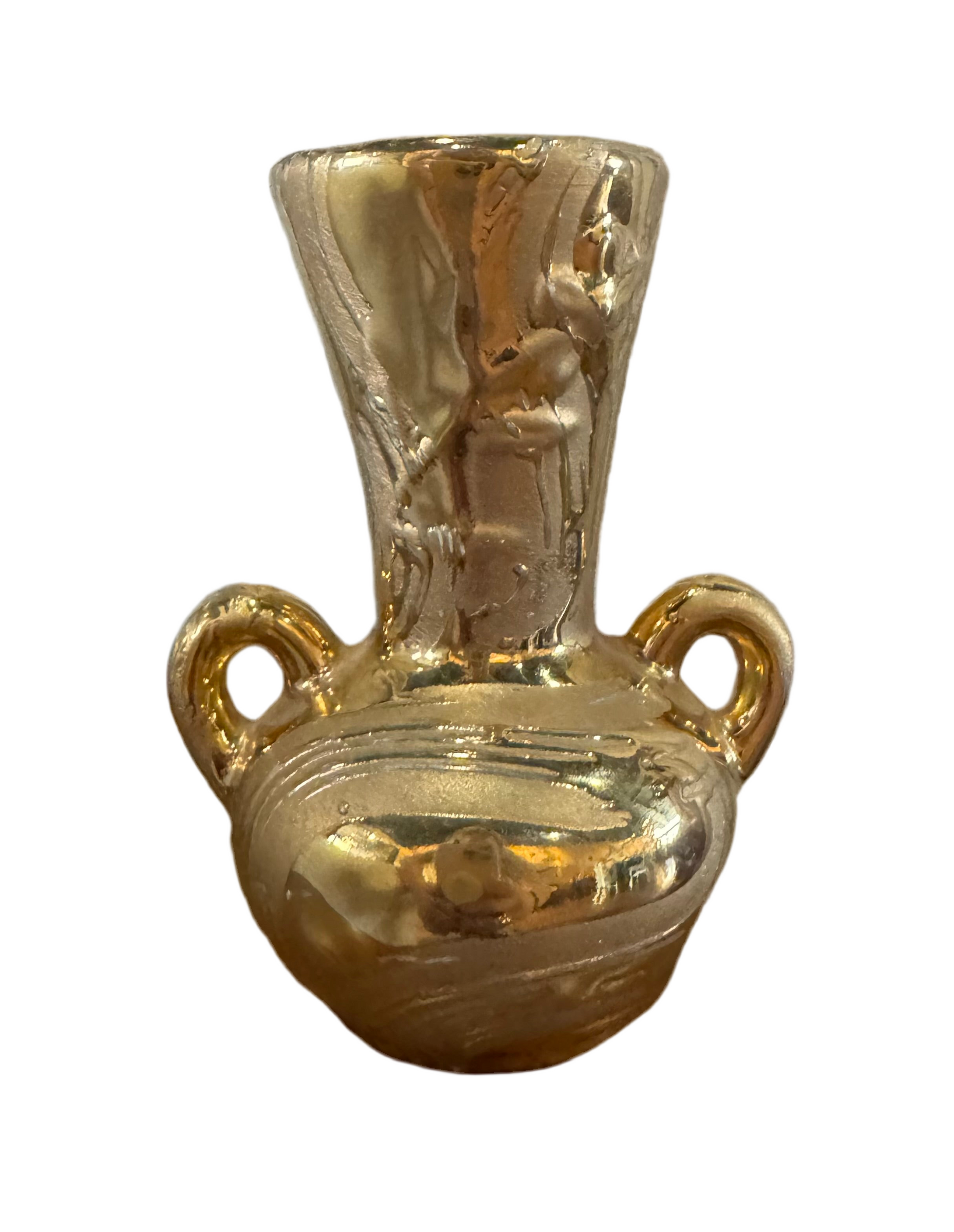 Small gold ceramic vase by The Vault Creative with a smooth, glossy finish and a rounded shape for decorative display.