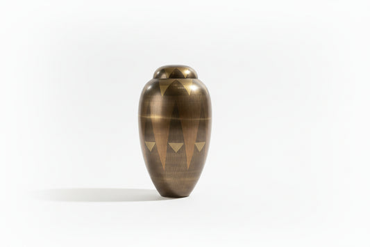 Bronze geometric vase by The Vault Creative with angular shapes and a metallic finish for modern home décor.