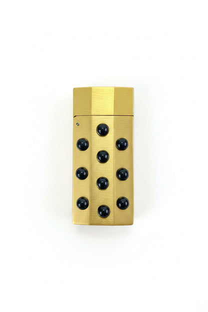 P. Grunsfeld Stoner Lighter by The Vault Creative, close-up of the stylish metal lighter with engraved design and ignition mechanism