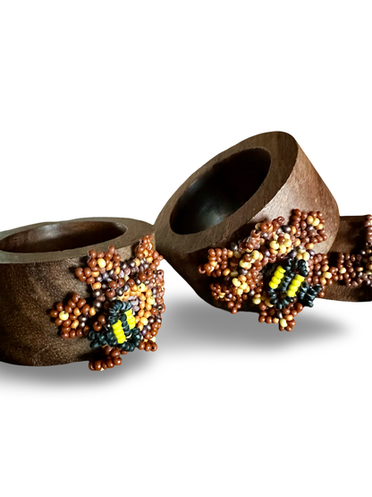 Handmade bee-shaped napkin rings by Phoebe, featuring detailed bee designs perfect for elegant table setting accessories.