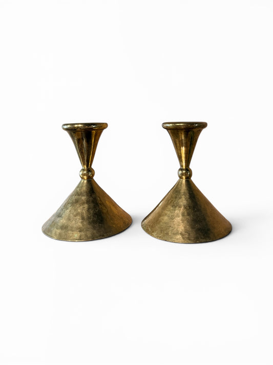 Vintage brass candle sticks from The Vault Creative featuring antique-style holders with a polished finish and classic design.