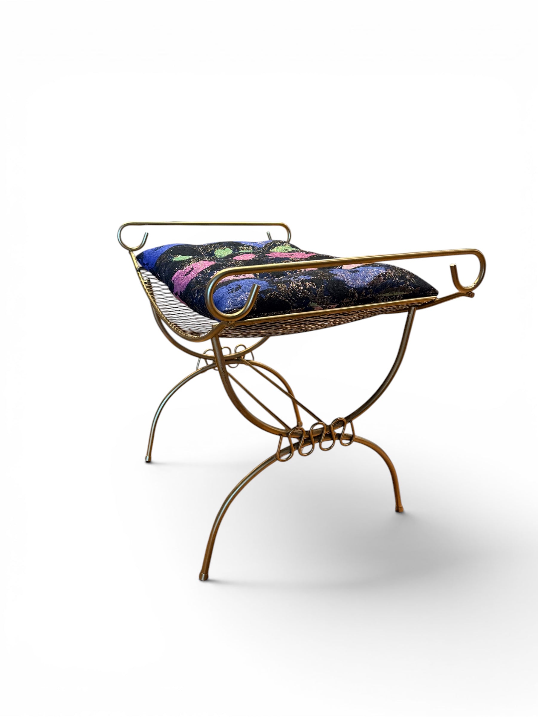 Vintage gold vanity bench by The Vault Creative with ornate legs and plush cushioned seat, perfect for classic dressing tables.