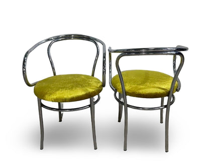 Set of four chrome Thonet chairs with sleek metal frames and curved wooden seats by Ozmun Home.