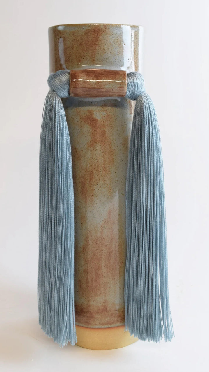 Karen Tinney blue vase by The Vault Creative with a sleek, modern design and glossy finish.