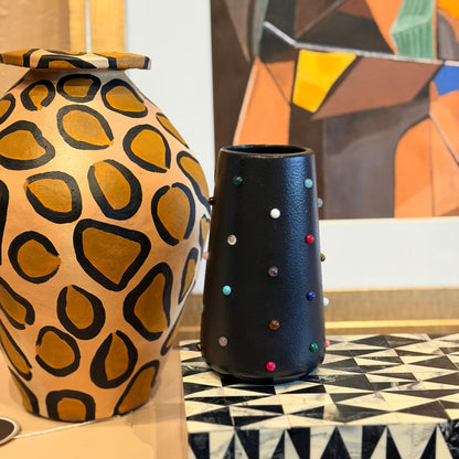 The Vault Creative P. Grunsfeld Tinies 6-inch ceramic vase with a smooth, glossy finish and modern design.