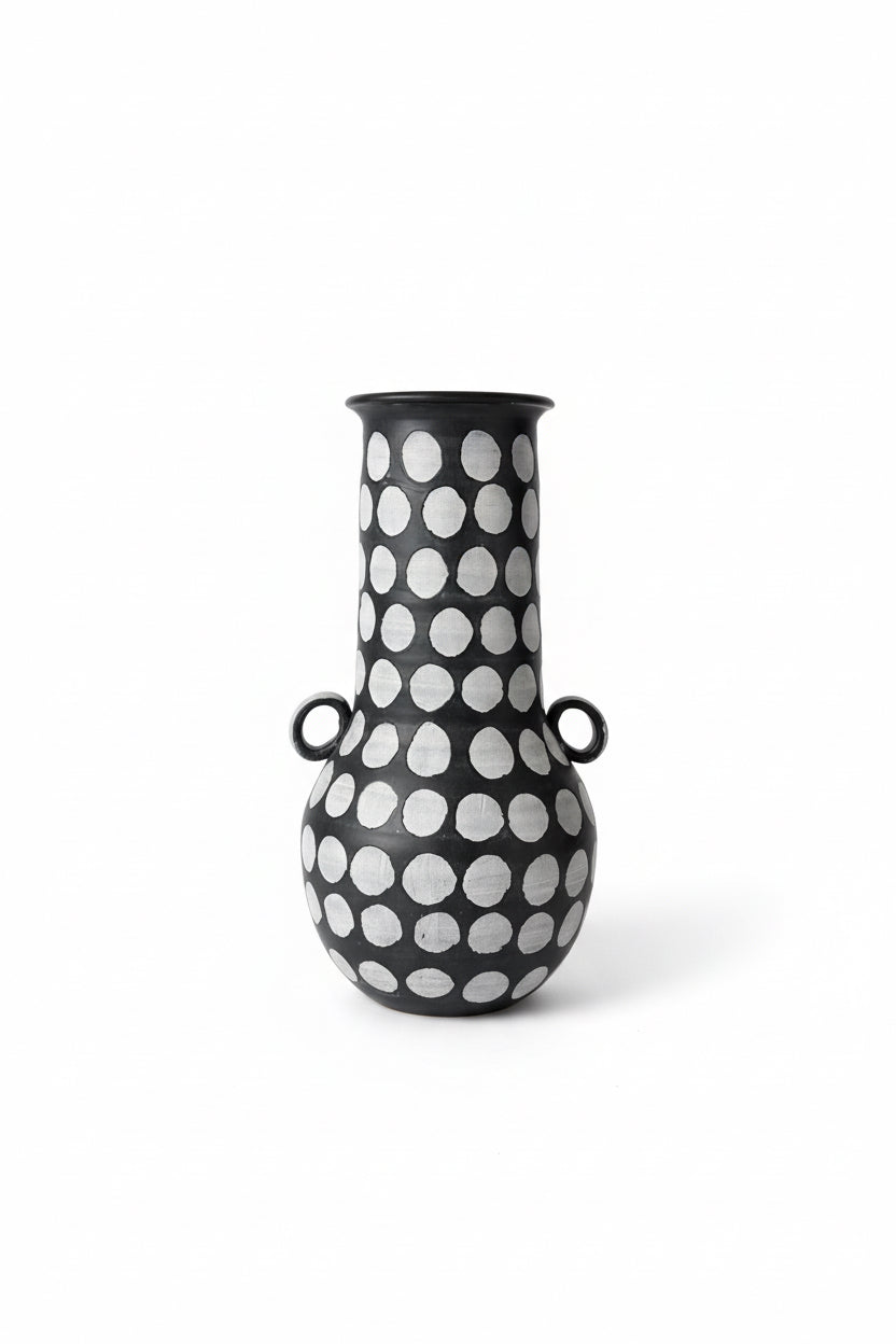 Polka dot ceramic vessel by The Vault Creative, showcasing a stylish ceramic container with a polka dot pattern.
