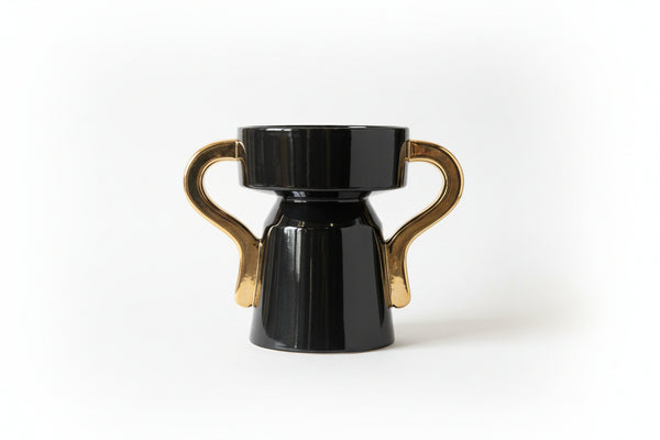 French black and gold ceramic vase by The Vault Creative, featuring elegant design and glossy finish for stylish home decor.