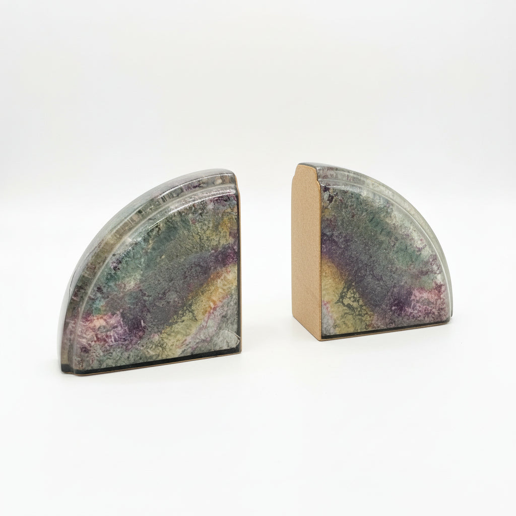 Elizabeth French Stone Bookends featuring elegant, carved stone design to hold and display books on a shelf.