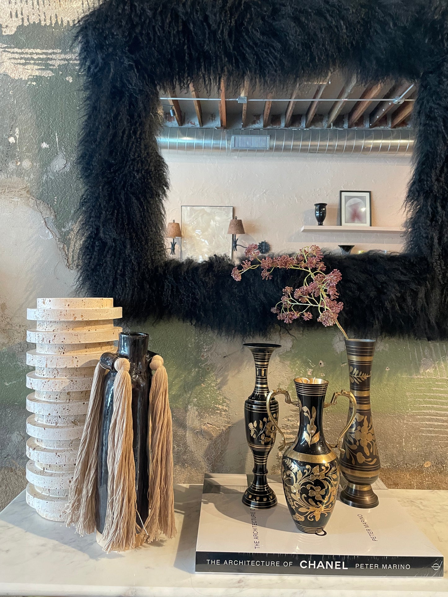 Fluffy fur mirror by The Vault Creative with a soft, plush frame and round reflective surface for stylish decor.