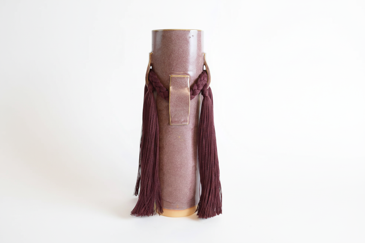 Elegant ceramic vase in burgundy by The Vault Creative, featuring a smooth finish and modern design.
