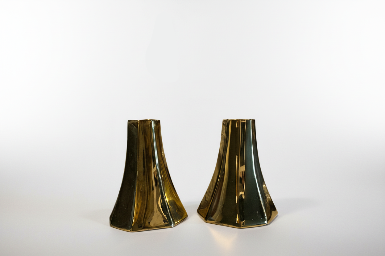 Pair of brass and glass French candle holders by The Vault Creative, featuring elegant design and classic candle display.