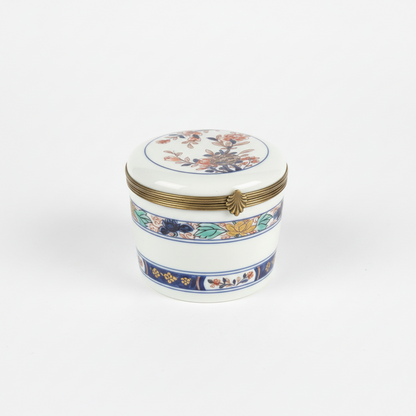 Vintage Limoges porcelain box with intricate floral design, crafted by The Vault Creative, showcasing fine craftsmanship and delicate details.
