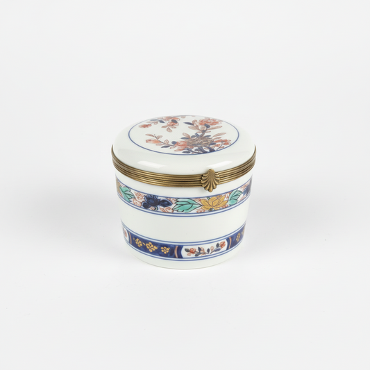 Vintage Limoges porcelain box with intricate floral design, crafted by The Vault Creative, showcasing fine craftsmanship and delicate detailing.