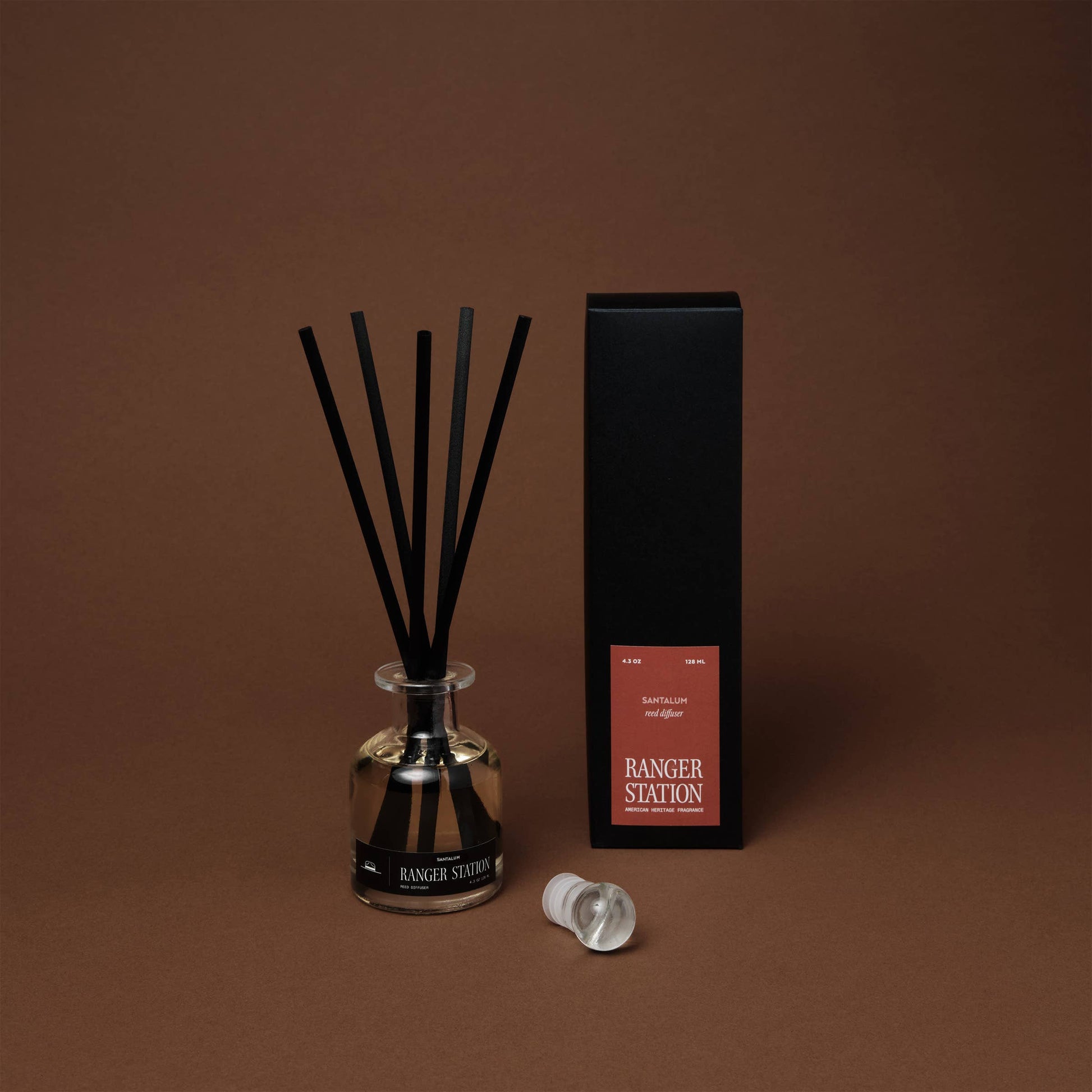 Santalum Reed Diffuser by Ranger Station Wholesale with natural reed sticks and a decorative glass bottle for home fragrance.