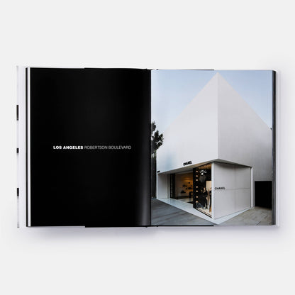 Close-up of the book cover titled "The Architecture of Chanel" by Phaidon, featuring elegant black-and-white Chanel branding.