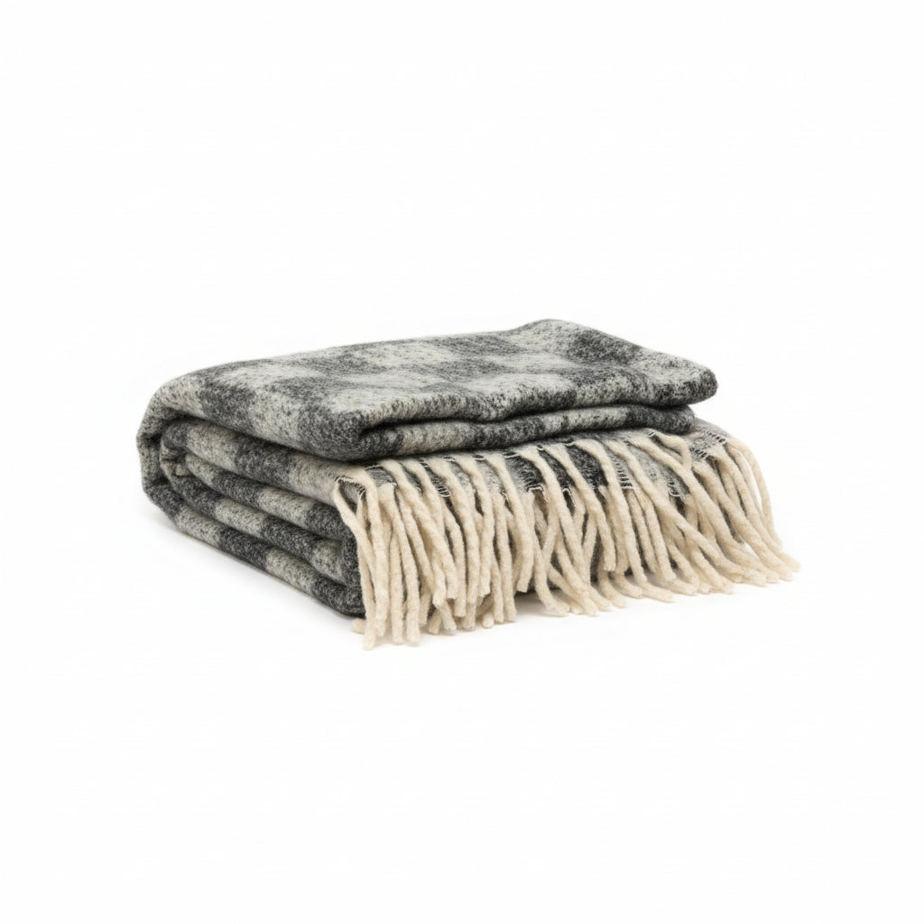 French cozy chunky checkered throw blanket by The Vault Creative, featuring a soft, thick, plaid pattern in warm tones.