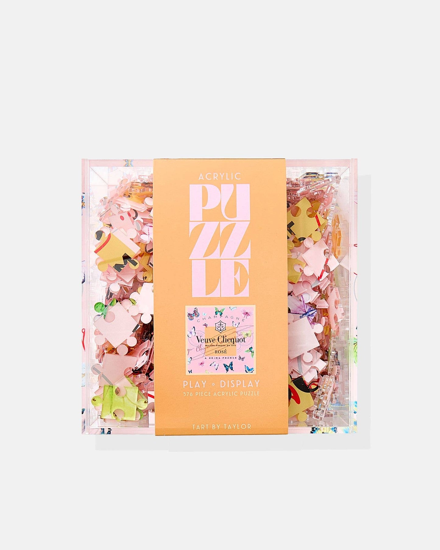 Rose Butterfly Acrylic Puzzle by Tart By Taylor, colorful puzzle pieces featuring a floral and butterfly design on shiny acrylic surface.
