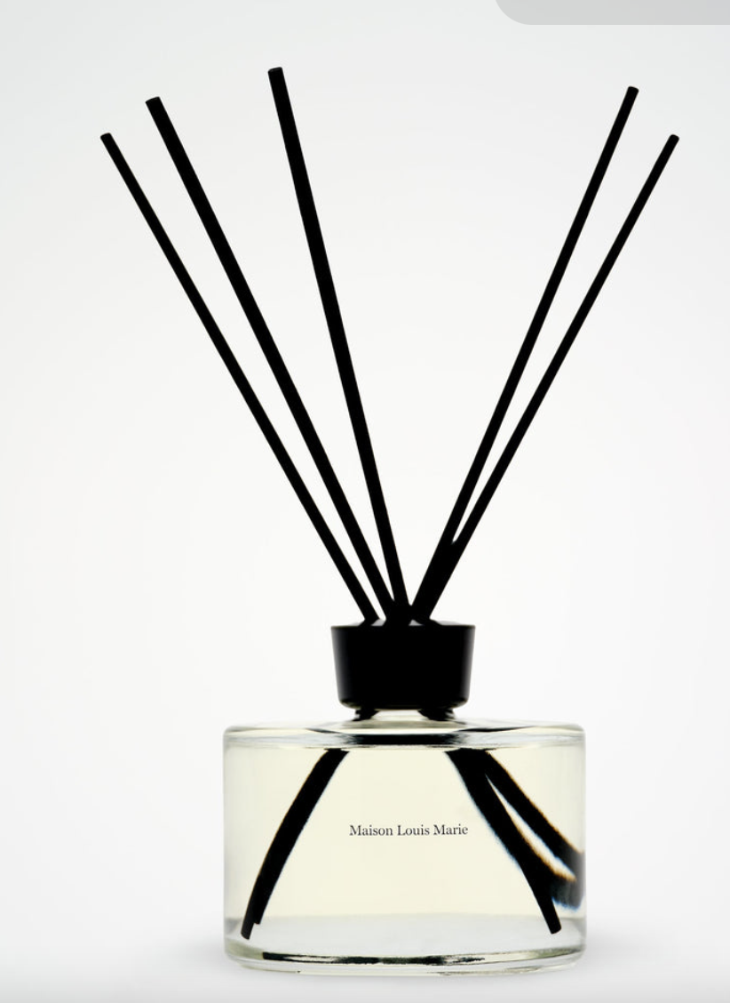 Maison Marie Louis No. 14 diffuser candle by The Vault Creative with elegant glass container and reed sticks for fragrance diffusion.