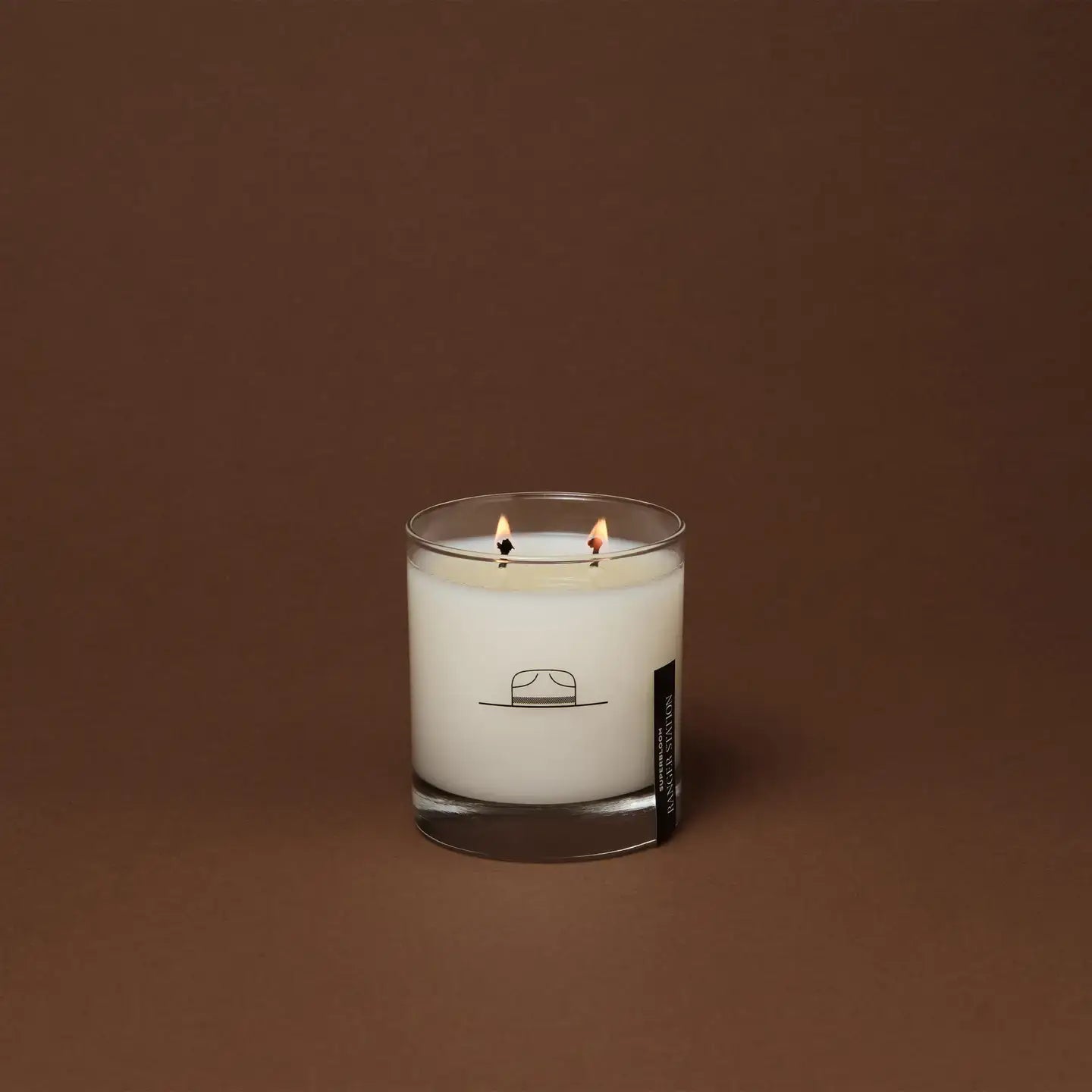 Ozmun Home Superbloom Candle with vibrant floral design and warm glow, perfect for home decor and ambient lighting.