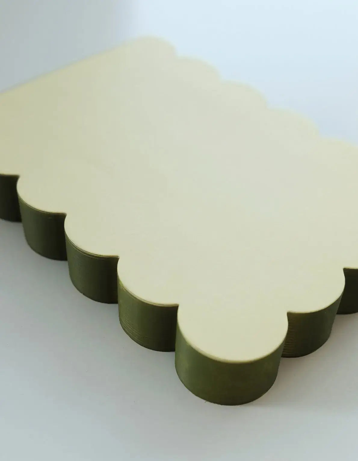 Scalloped shaped notepad with chartreuse and olive edges by Idlewild Co. featuring a decorative, vintage-inspired design.