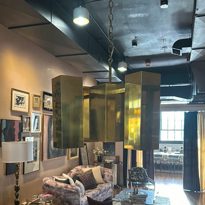 Mid Century Brass Chandelier by Stone Textile featuring polished brass finish and elegant hanging design.