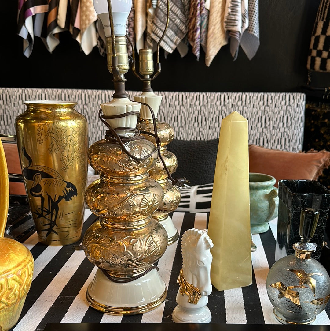 Pair of gold gilt lamps from Ozmun Home with ornate bases and elegant fabric shades, perfect for classic interior decor.