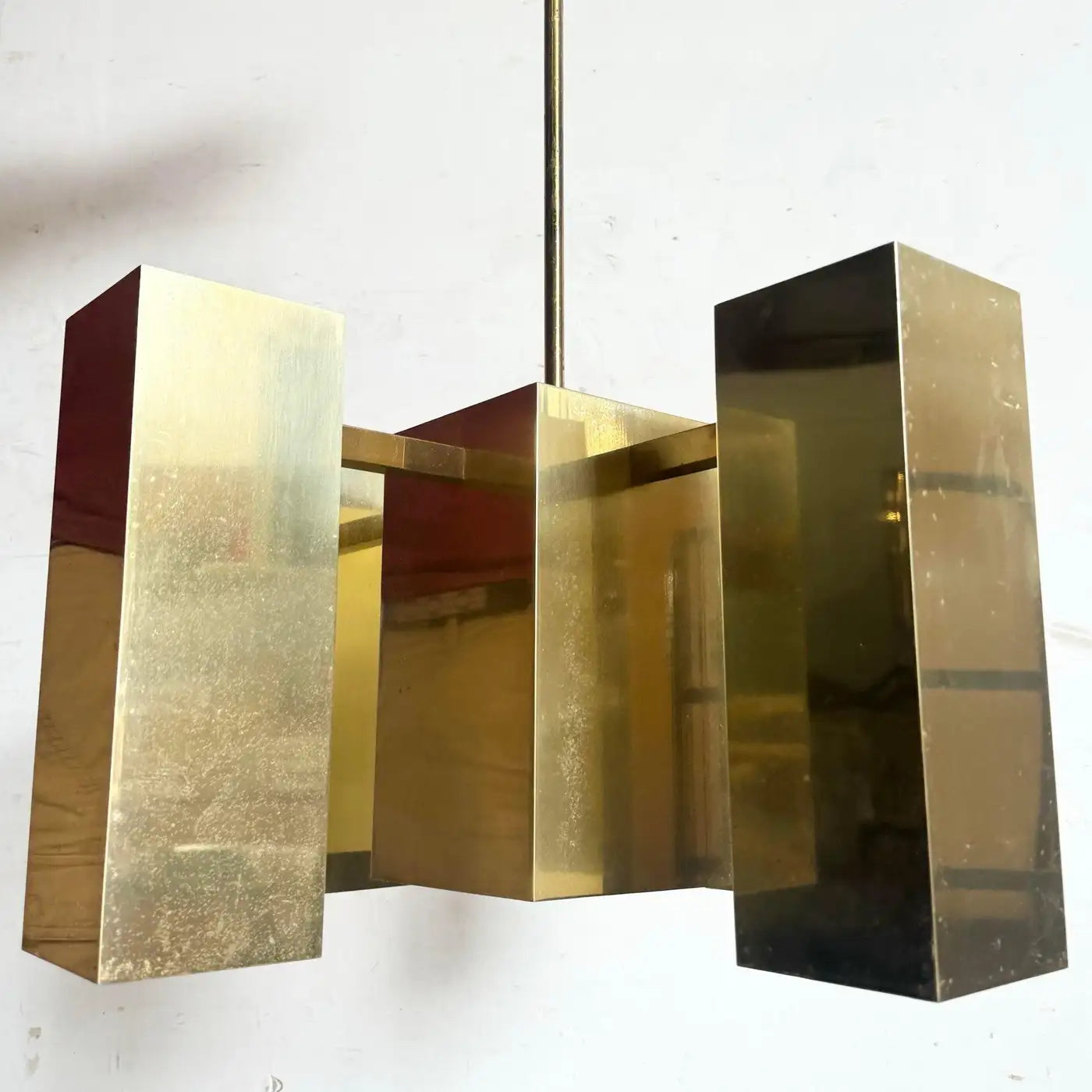 Mid-century brass chandelier with a modern gold finish, inspired by Robert Sonneman style, designed by Stone Textile.